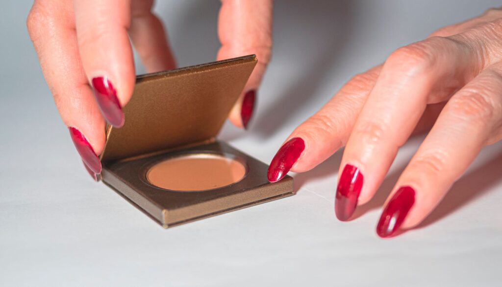 Nail extension application in progress showing the technique and tools used